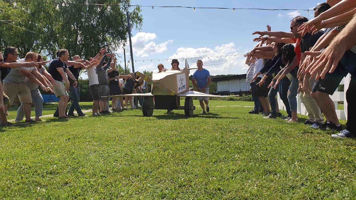 Teams competing with plane they built in Flat Out Aviator teambuilding