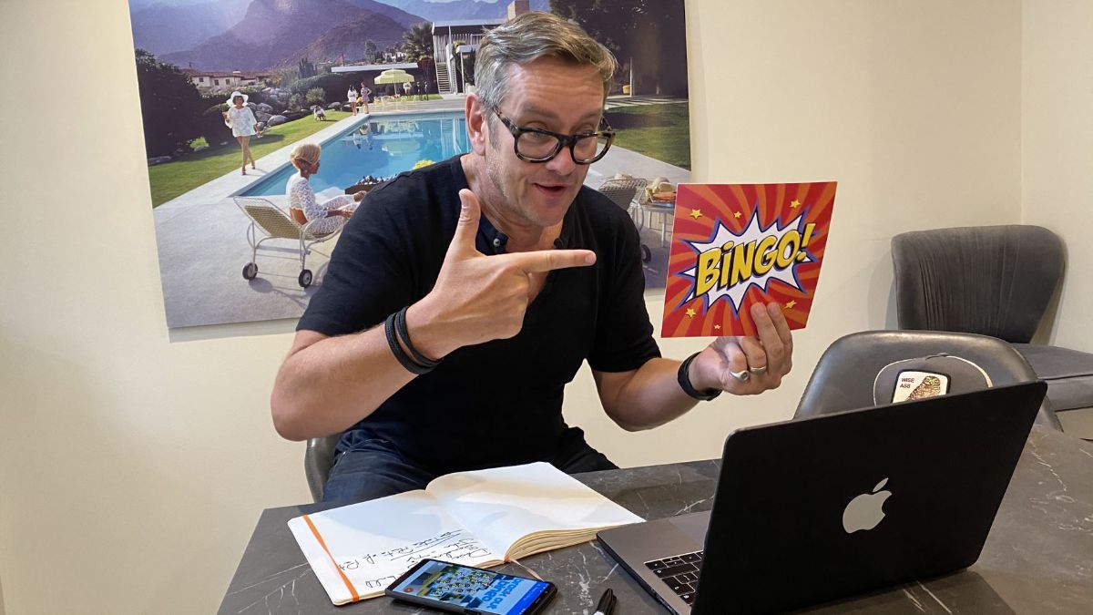 Man Playing Break Out Bingo Online Teambuilding Game from Catalyst