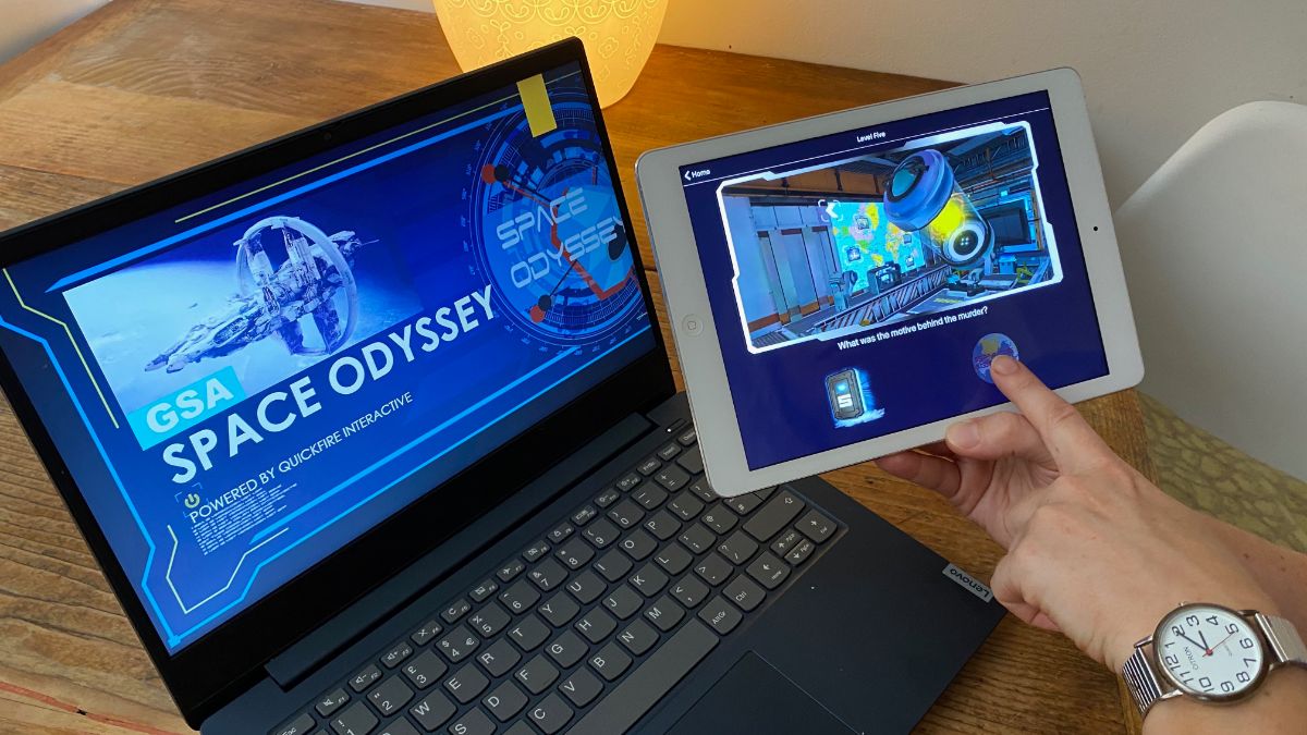 Notebook and tablet used for playing Space Odyssey Online Teambuilding Game Level Five