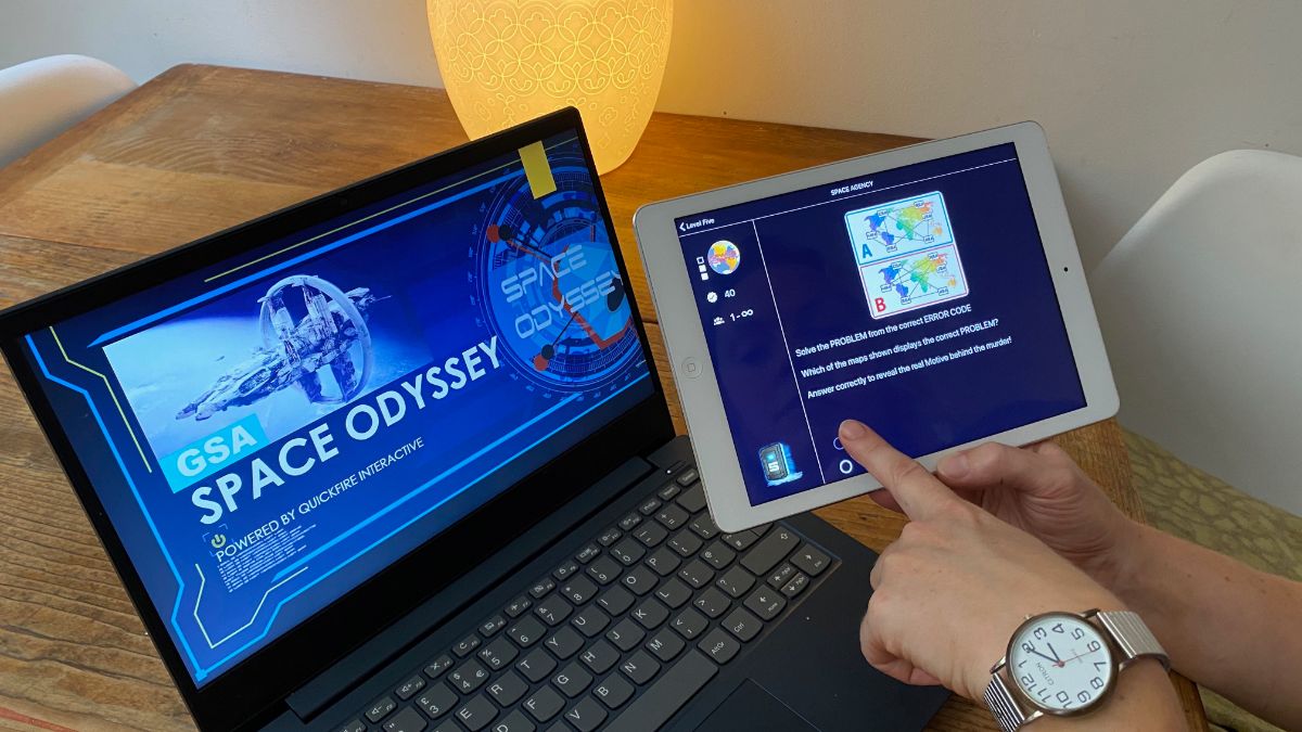 Notebook and tablet used for playing Space Odyssey Online Teambuilding Game